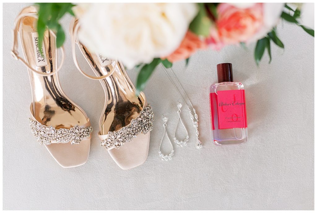bridal shoes, perfume, jewelry flatlay
