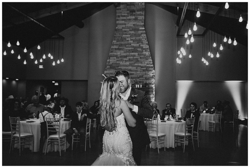 bride and groom first dance in black and white