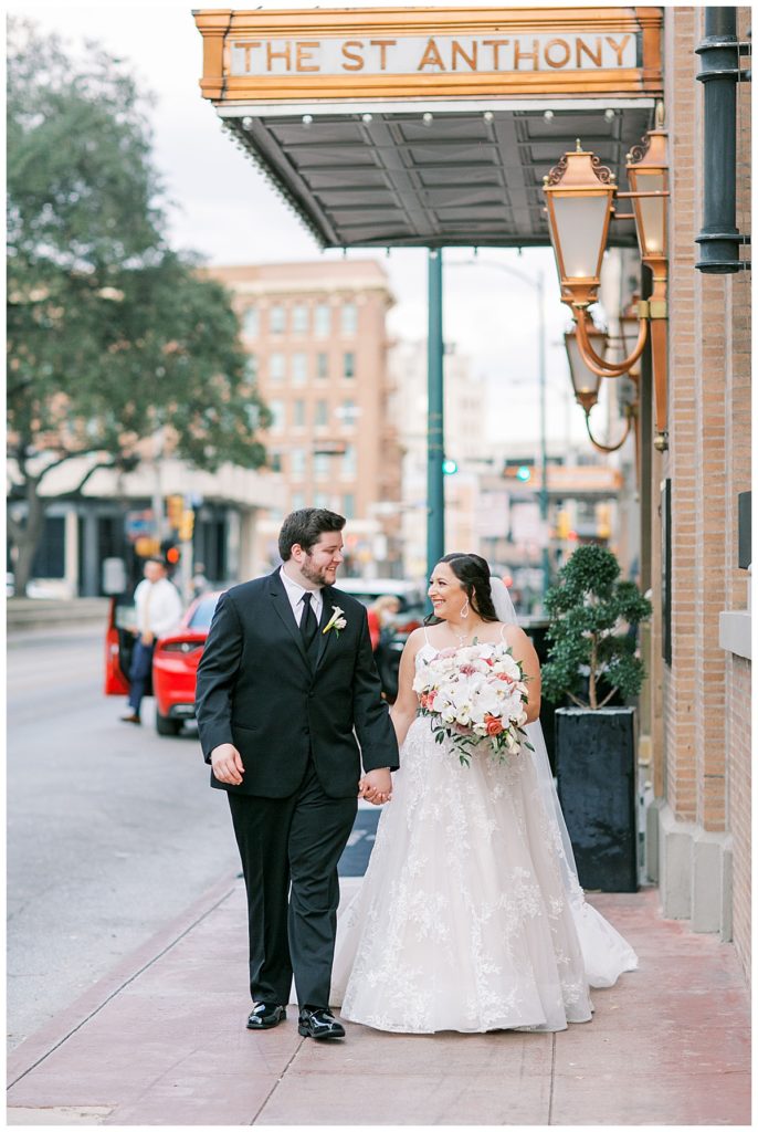 bride and groom walking in downtown San Antonio