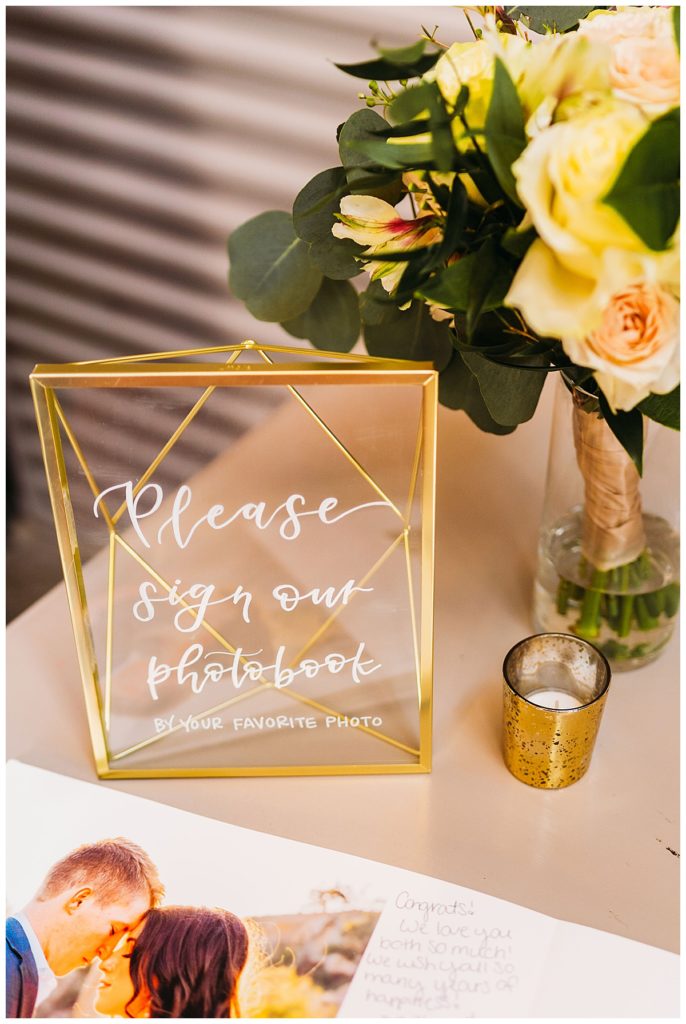 reception decor that says to sign photo guest book