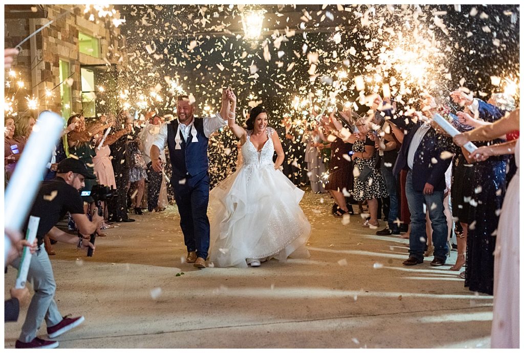 bride and groom exit with confetti cannon in San Antonio