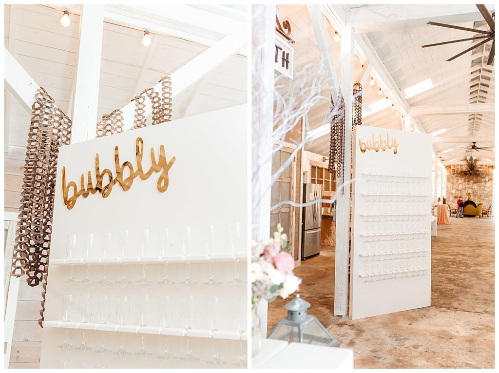 white champagne wall with gold acrylic bubbly sign