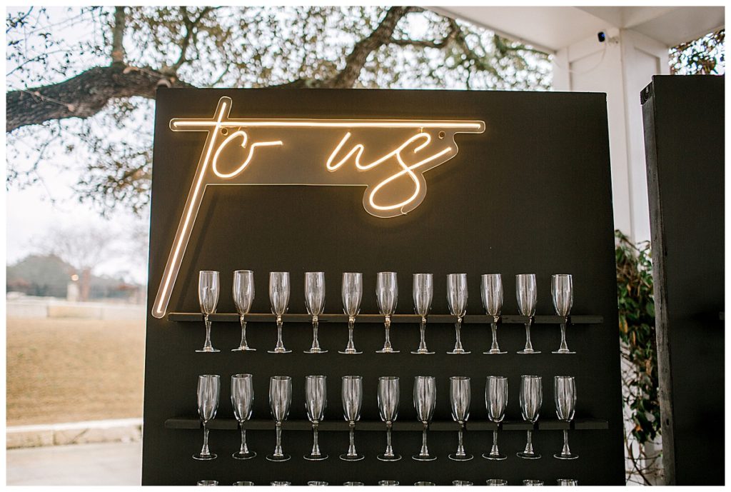 custom champagne wall with neon sign
