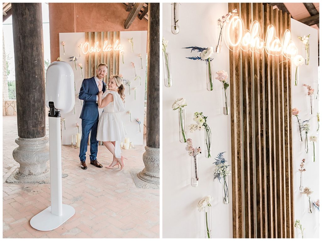 bride and groom in front of custom photobooth backdrop in San Antonio