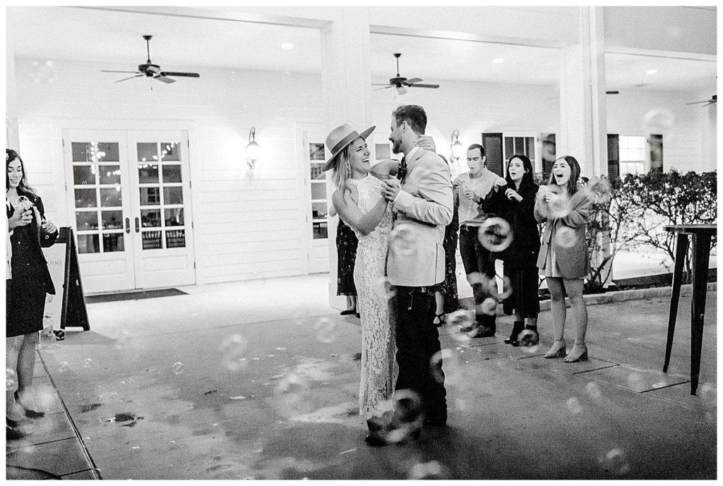 bride and groom bubble exit in black and white photo