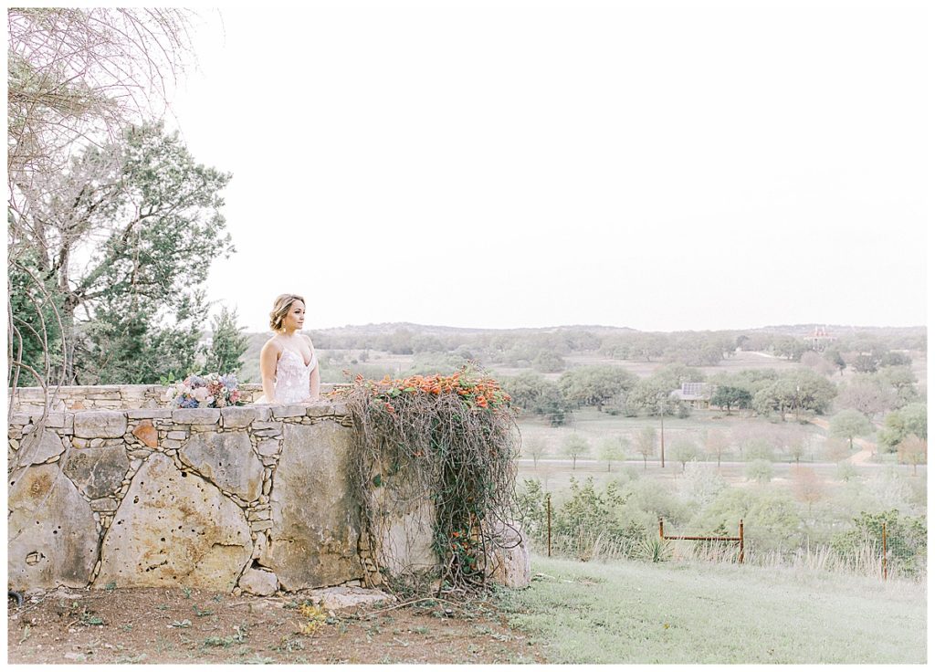 bride overlooking Texas hill country at Camp Lucy
